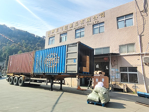 Container being loaded at the entrance of a company